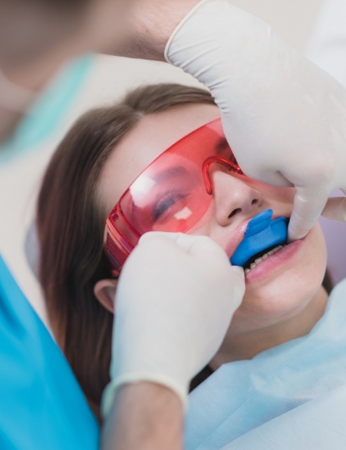 Dental patient receiving fluoride treatments