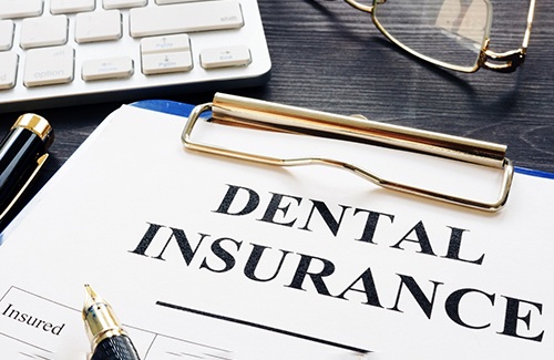 a dental insurance form on the table 
