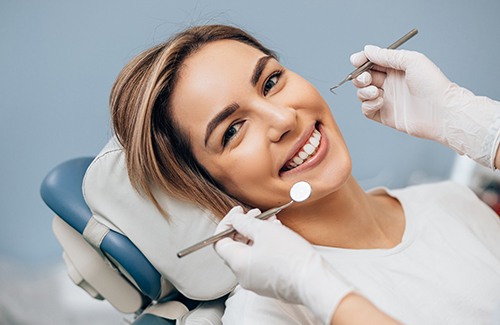 Woman receiving preliminary dental implant surgery
