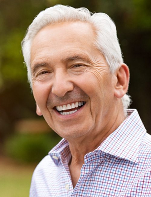 closeup of man smiling outside