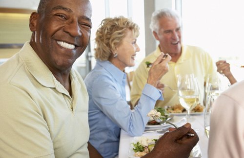 older people eating dinner 