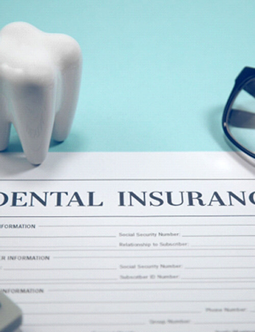 dental insurance form, molar, eyeglassses and calculator