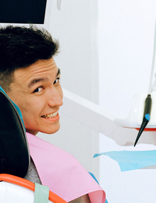 sitting man in dentist chair