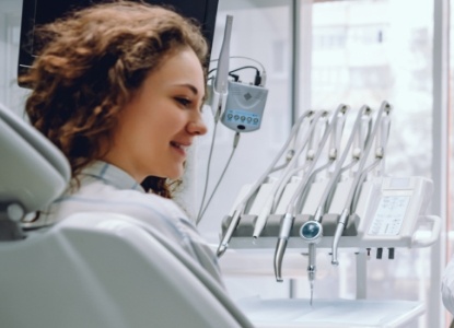 Woman smiling during dental checkup and teeth cleaning