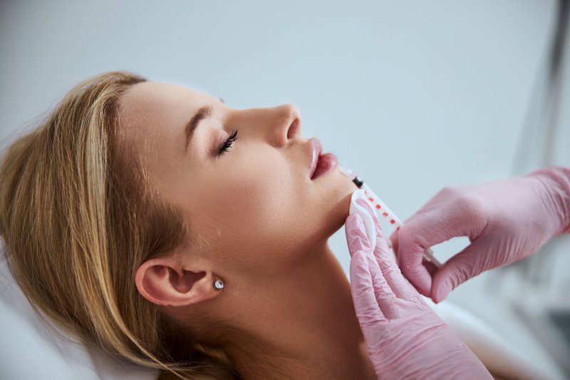 young woman getting dermal fillers